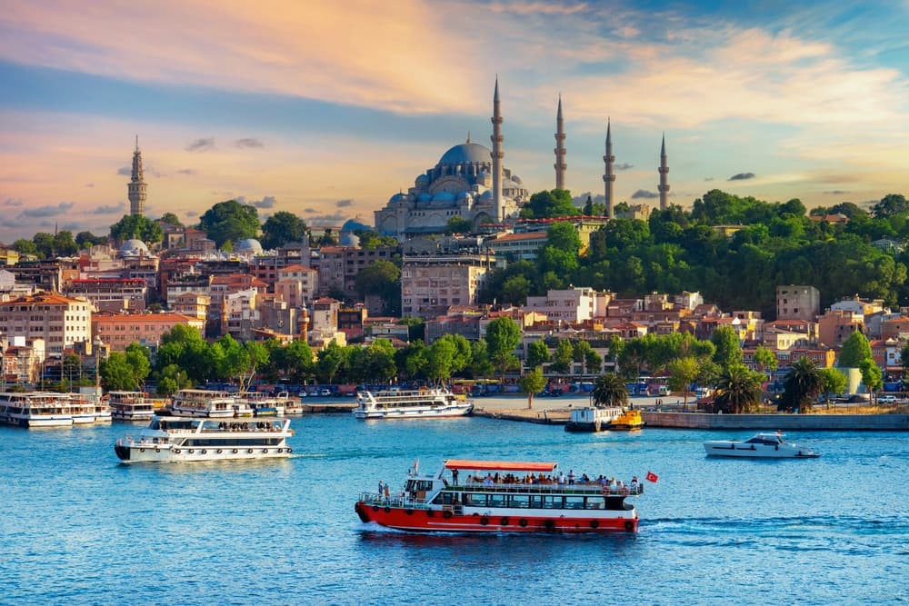 Boats cruising the Bosphorus at sunset